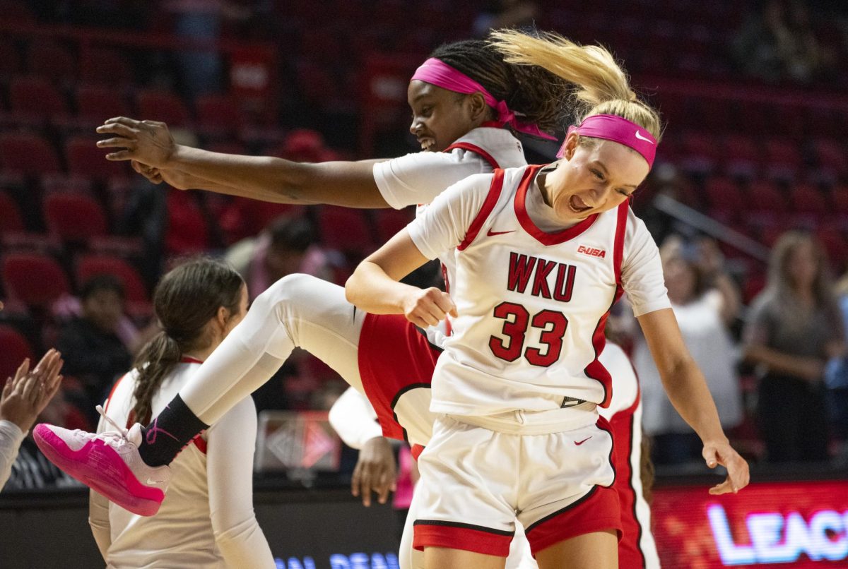 Guard Josie Gilvin (33) and guard Karis Allen (32) celebrate after their win against La Tech on Wednesday, Feb. 7. WKU won 64-56.