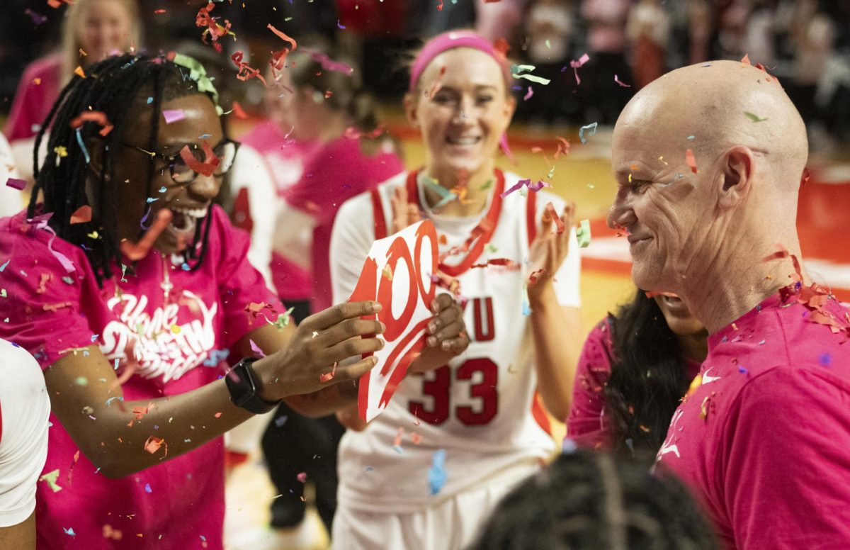 The+WKU+Lady+Toppers+celebrate+their+head+coach+Greg+Collins+100+career+win+on+Wednesday%2C+Feb.+7.