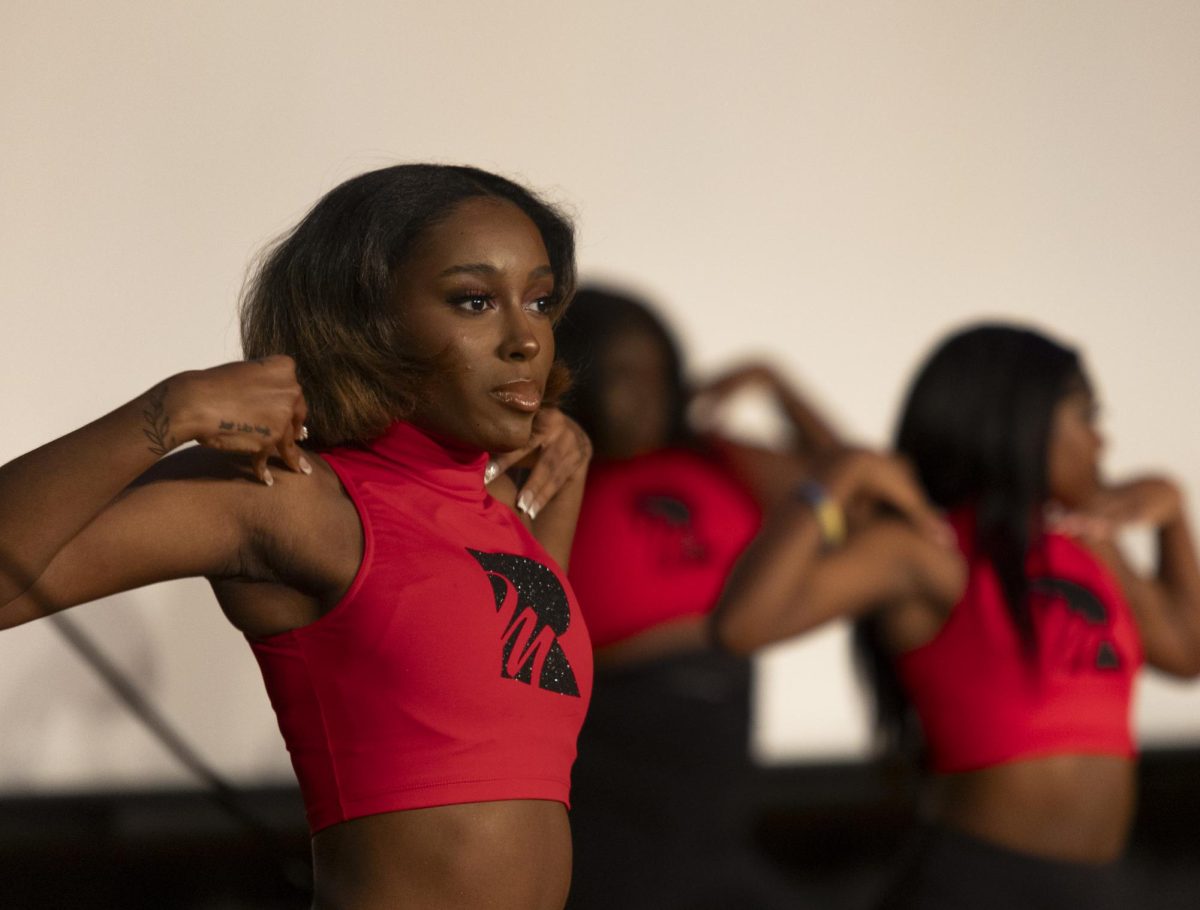 Members of Kaios Dance Company perform a choreographed dance during the Black Experience Showcase in the Downing Student Union auditorium on Wednesday Feb. 28, 2024.