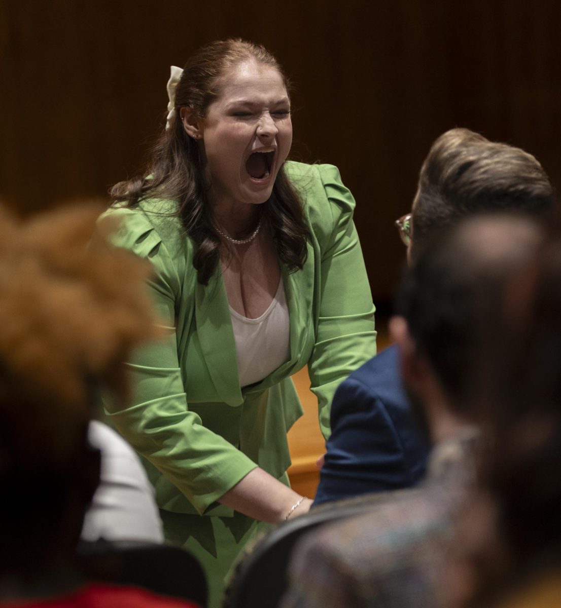 Kirsten Eversmann, a sophomore criminology and sociology major, preforms an “after dinner speech” in which she preformed a comedic informative speech about women’s voices and silencing them, during the Forensics “Meet The Team Show- case” at the Ivan Wilson Fine Arts Center Recital Hall in fall 2023.