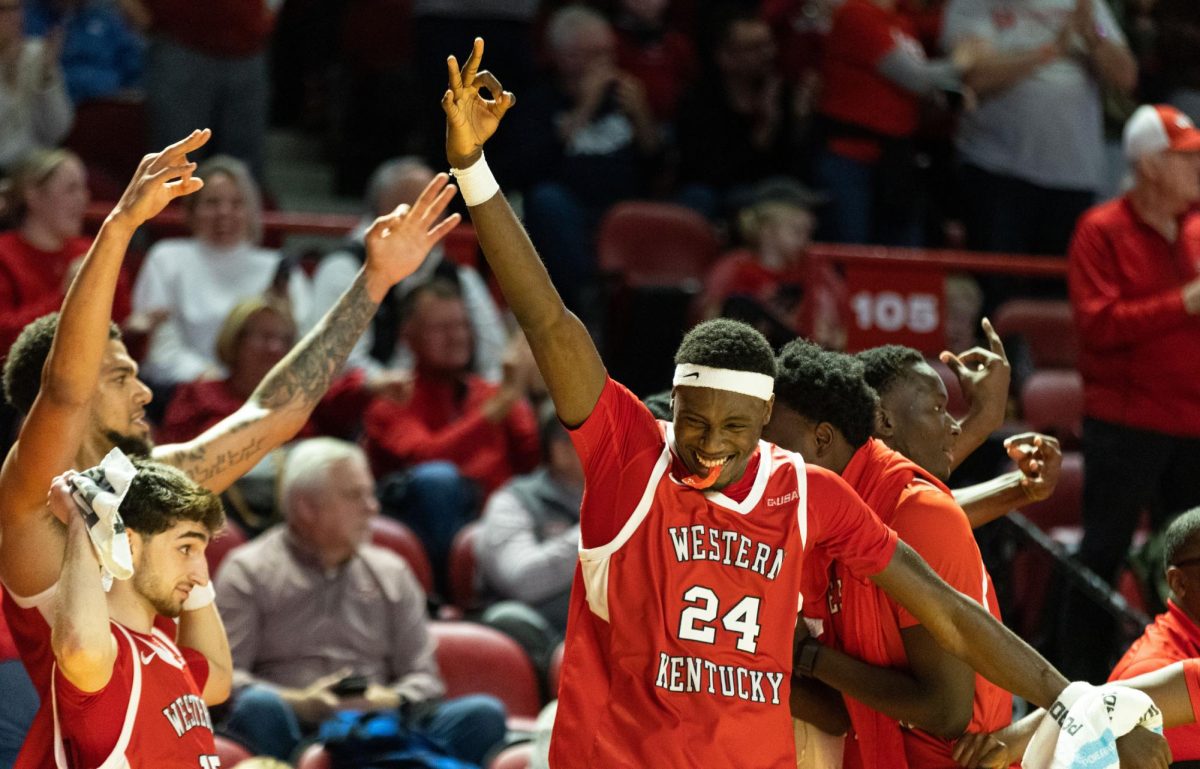Forward Tyrone Marshall Jr. (24) and the bench  celebrate guard Tyler Olden’s first three-pointer this season during a home game against MTSU in the Diddle arena on Saturday, Feb. 3. 