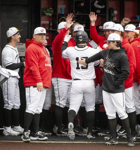 The WKU baseball team celebrates Brady Brownings (15) home-run during Western Kentucky Universitys games against University of Wisconsin, Milwaukee on Friday, March 8, 2024. 