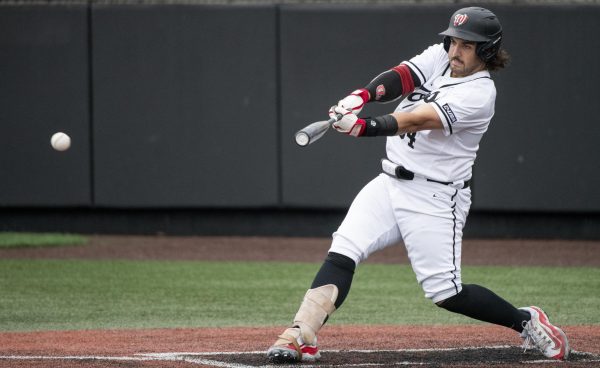 Infielder Blake Cavill (34) hits a double during Western Kentucky Universitys game against University of Wisconsin, Milwaukee on Friday, March 8, 2024. 