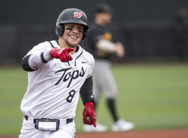 Catcher Camden Ross (8) celebrates his home-run during Western Kentucky Universitys games against University of Wisconsin, Milwaukee on Friday, March 8, 2024. 