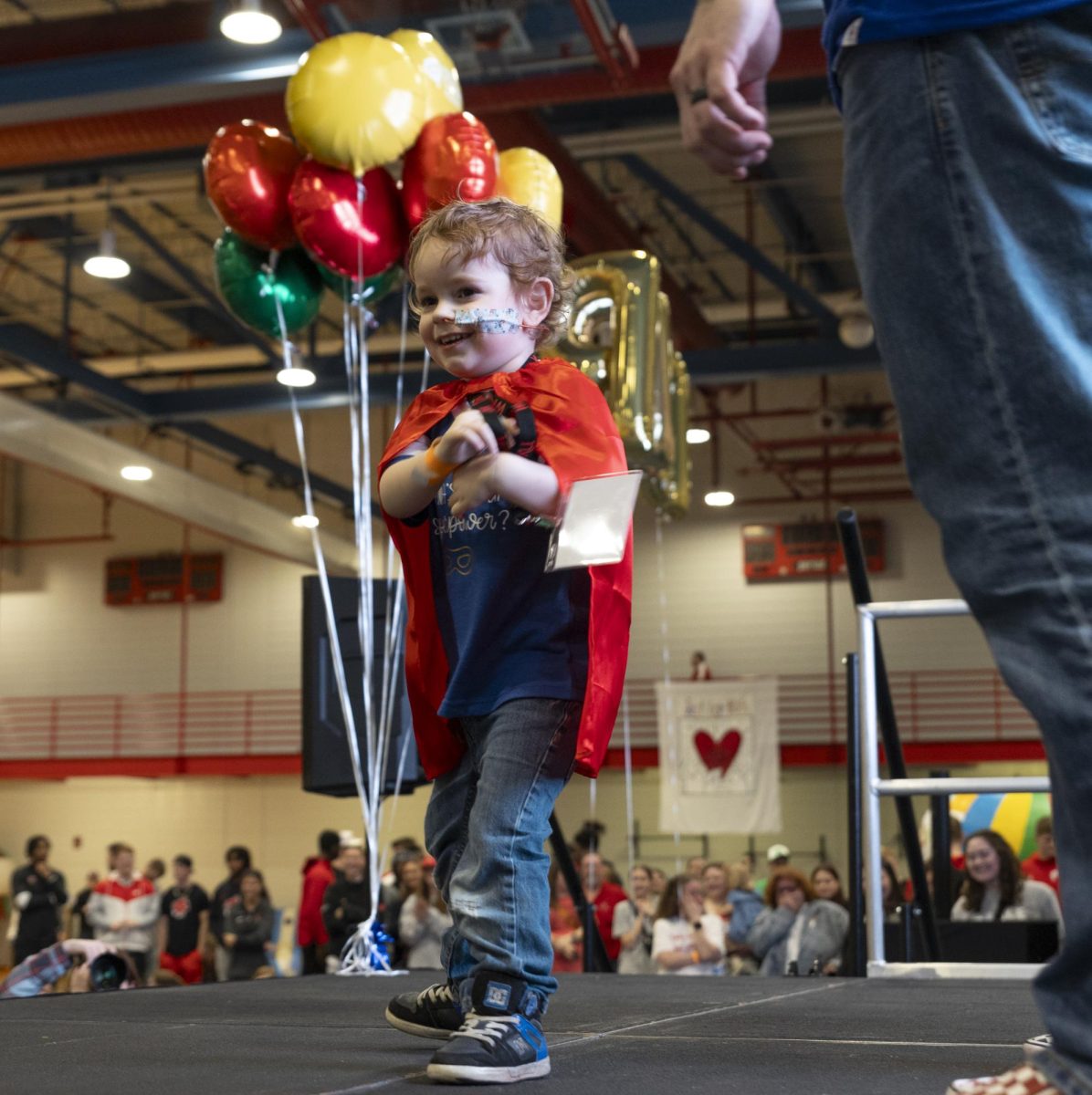 August Baker, 3, dances on stage during his family’s presentation about his involvement during Dance Big Red in Preston Center on Friday, March 8.
