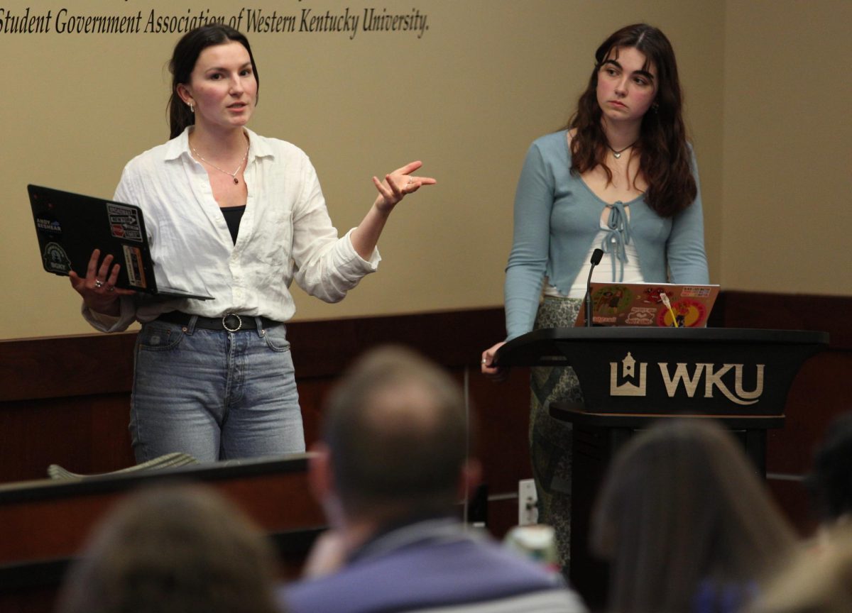 WKU senior public relations student Alex Cissell (left) and SGA Senator at Large Sophia Bryant (right) describe the details of Bill 36-23-S: Funding for the Hope Harbor X Denim Day Event during SGAs 20th meeting of the 23rd senate on Tuesday, March 12 in the senate chambers.