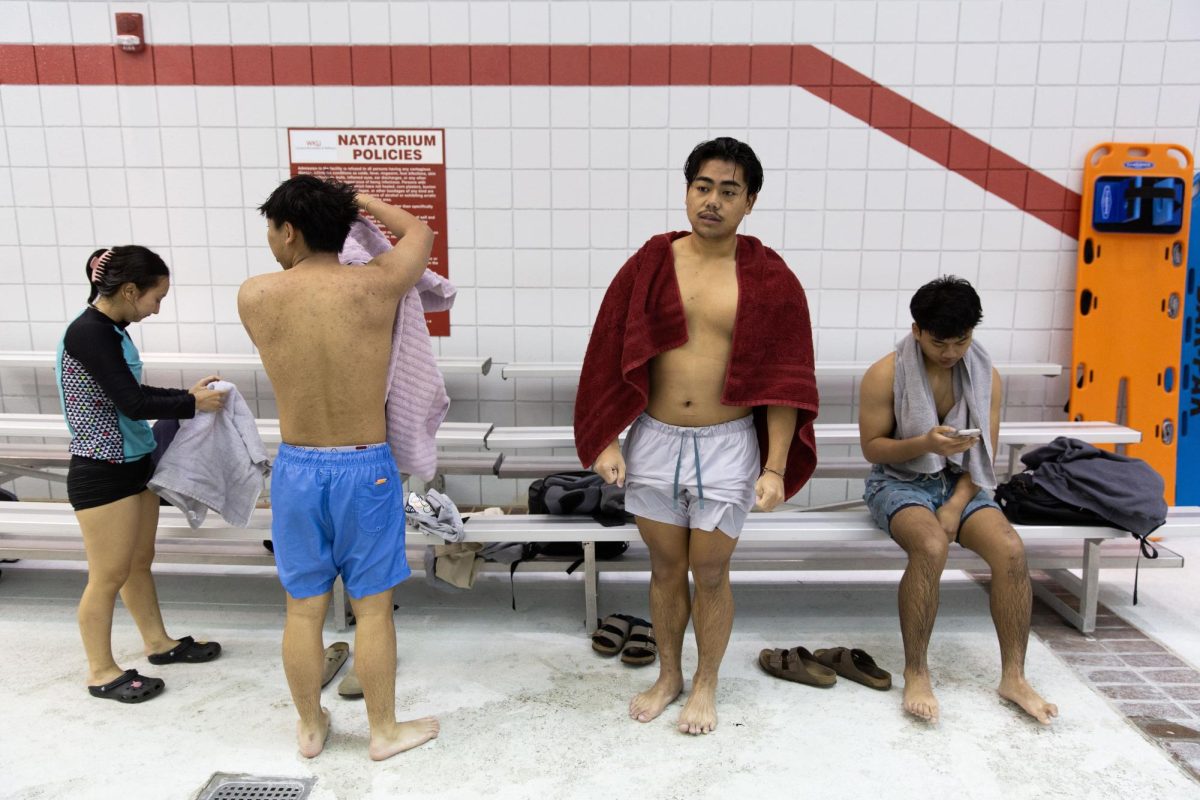 (From left) Pha Meh, Au Red, Hsar Moo, and Simon Khan dry off after receiving their first swim lesson in the Bill Powell Natatorium at Western Kentucky University in Bowling Green Ky. On Feb. 28, 2024. The group of friends came in with minimal experience, relying on lifeguard rafts to support their paddling, and left being able to float on their backs and swim in freestyle strokes. 