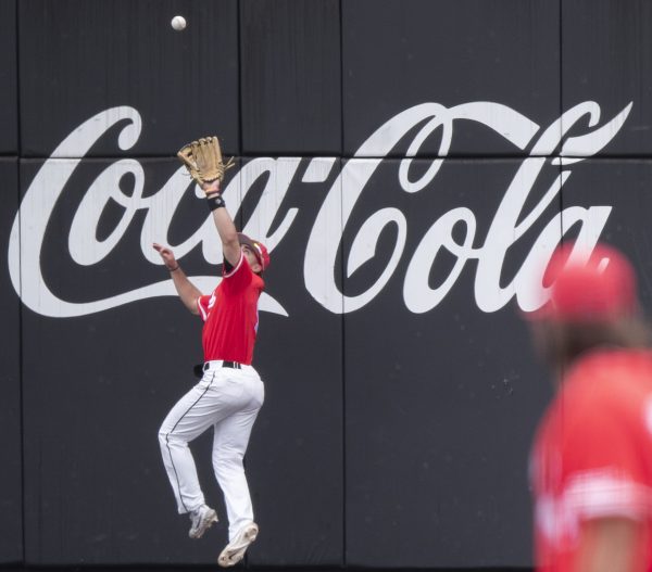 Outfielder Jaylin Rae (4) catches a fly ball against the wall during WKU’s game against Dallas Baptist University on Sunday, April 7, 2024. 