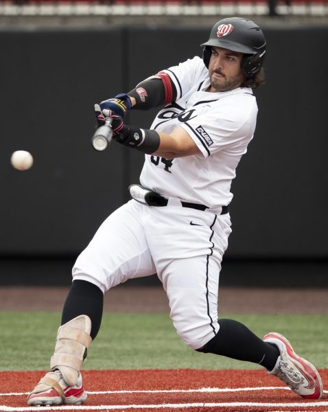 WKU infielder Blake Cavill (34) lands a hit to bring in the first run of the WKU game against University of Louisville on Tuesday, April 9, 2024.
