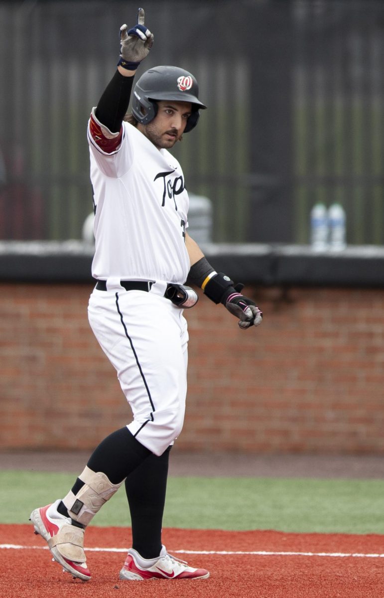 WKU infielder Blake Cavill (34) points to the sky in celebration of an RBI during a game against the University of Louisville on Tuesday, April 9, 2024.