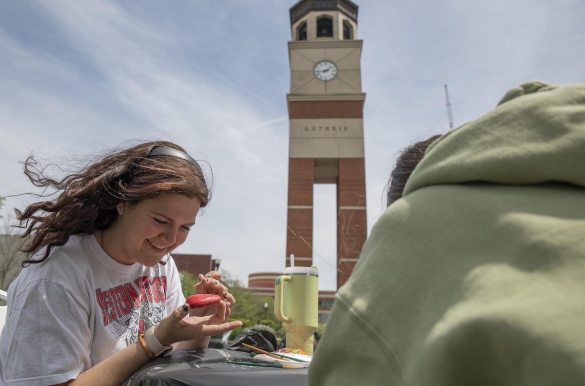 Ellie Bozarth, a freshman agriculture major, paints a rock as part of “Rage N Relax” an event hosted by Housing and Residence Life on Tuesday, April 23, 2024. 