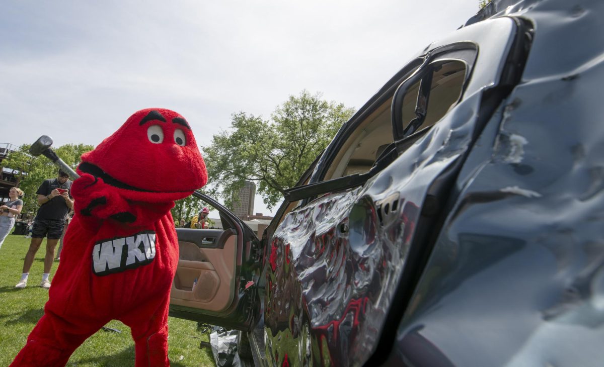 Big Red participates in a car smash during “Rage N Relax” an event hosted by Housing and Residence Life on Tuesday, April 23, 2024. Big Red interacted with students participated in both the “rage” and “relax” events.