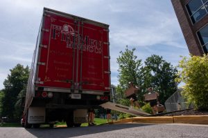 Employees for the Firemen Moving Company move furniture out of Hilltopper Hall and transport them to Zacharias Hall on Wednesday, June 12.