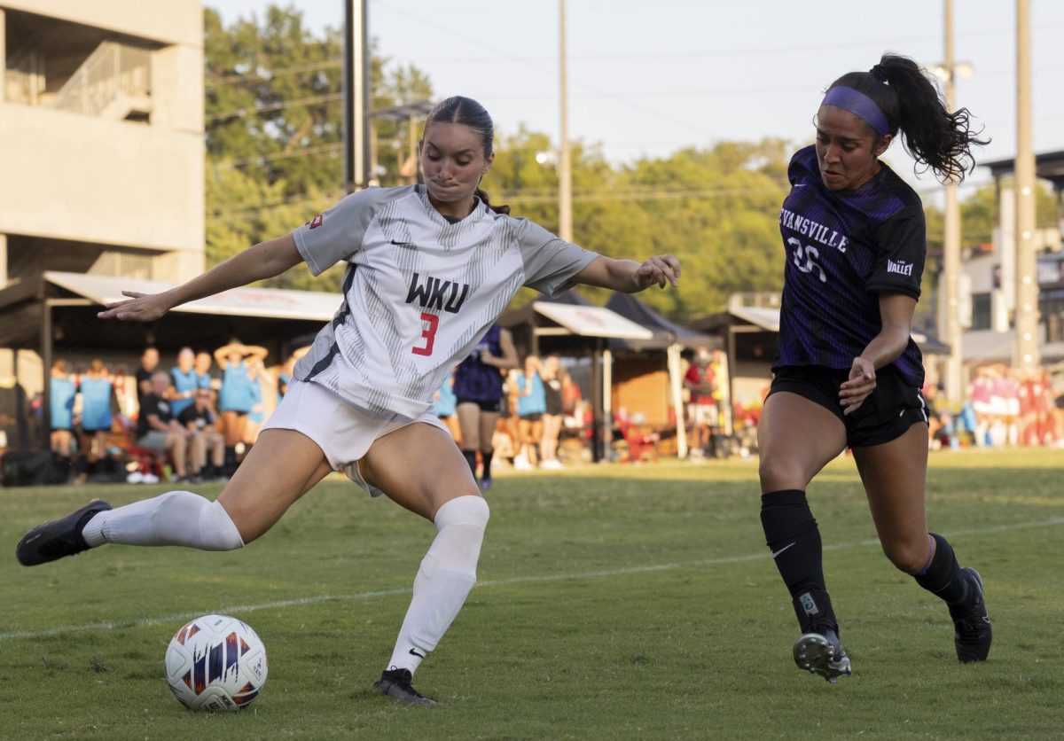 WKU forward Brooke Sleeva (3) attempts a goal guarded by University of Evansville’s defender Isa Valdez (26) during a game at WKU’s Soccer Complex on Sunday, Aug. 25, 2024. WKU won 4-1.