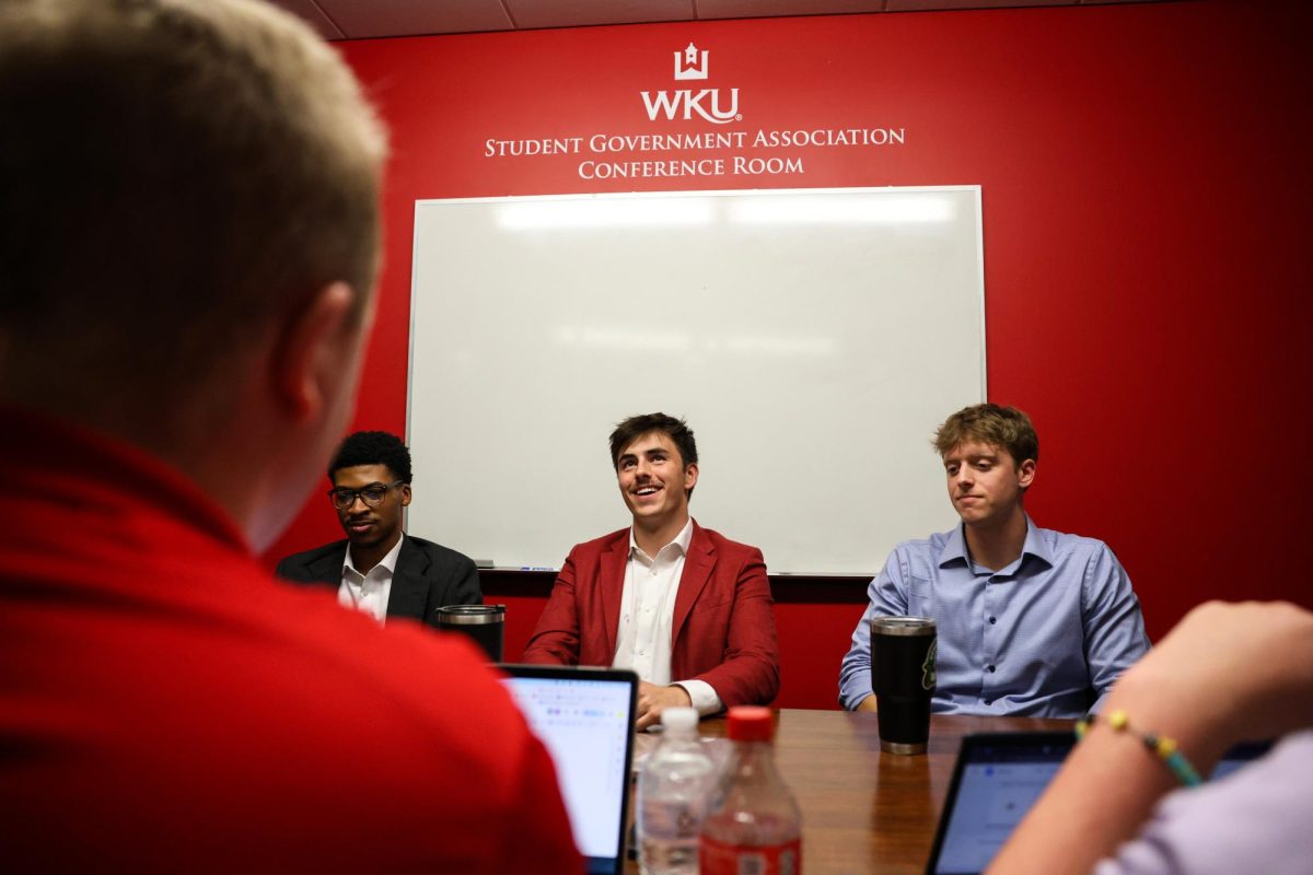 Student Body President Sam Kurtz, middle, answers a question while sitting next to Student Body Vice President Donte Reed, left, and Chief Financial Officer Ethan Taylor from Herald Editor-in-Chief Price Wilborn during the Herald’s meeting with SGA Executive Cabinet in Downing Student Union on Tuesday, Aug. 27, 2024.