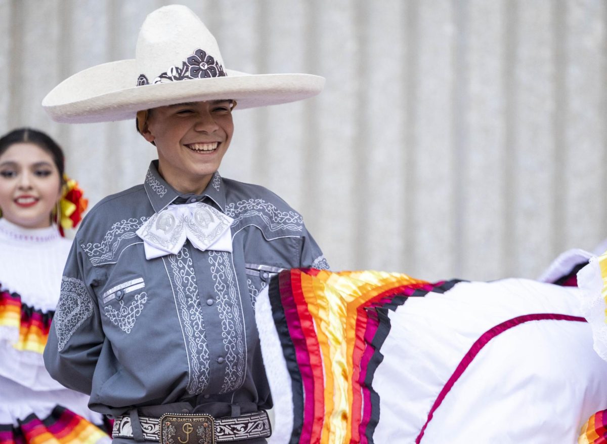 Julio Garcia smiles while dancing during WKU’s HOLAS All Around the World event on Monday, Sept. 16, 2024.