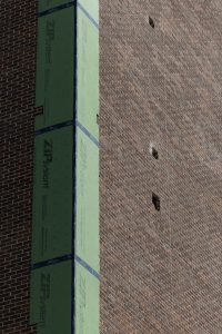 Masonry on Hilltopper Hall has been removed following construction and design issues with the building. Monday, Sept. 9, 2024.