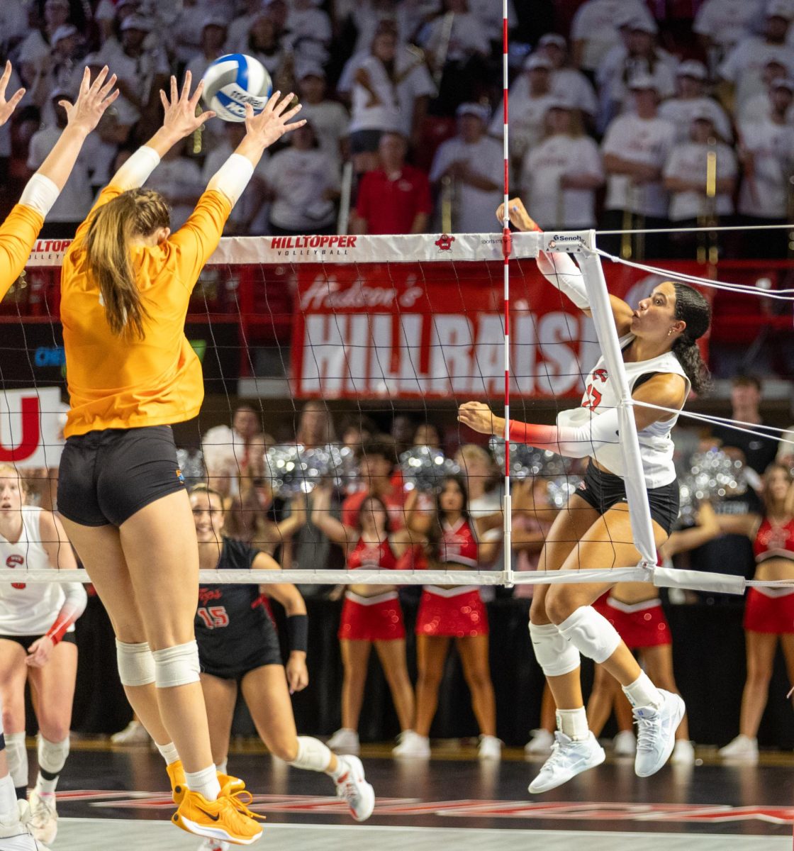 Outside hitter Alivia Skidmore (17) attempts to hit a ball past the defense in a game against the University of Tennessee at Diddle Arena on Tuesday, Sept. 10, 2024. 