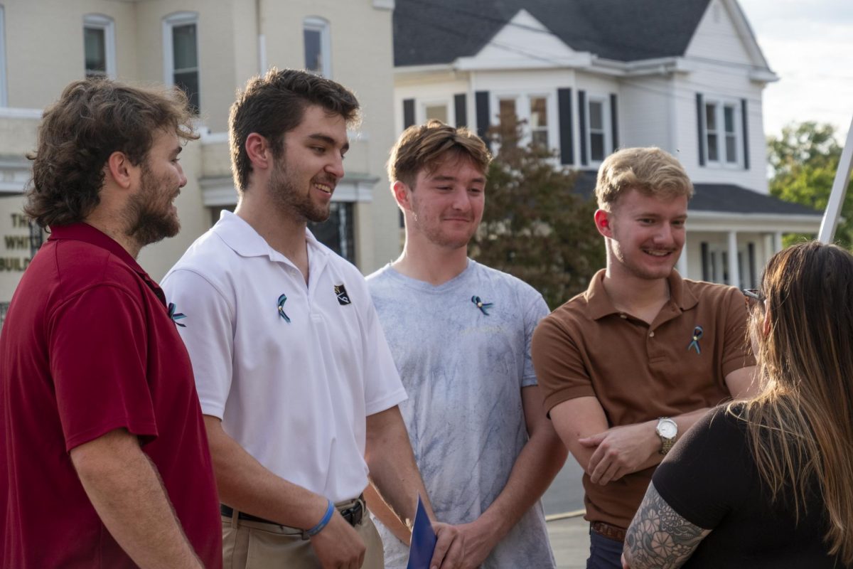 Sigma Nu brothers (left to right) Adam Vincent, Braden Clough, Elliot Tapp and Gabe Carson have a conversation following the Suicide Prevention Proclamation event hosted by LifeSkills on September 18.