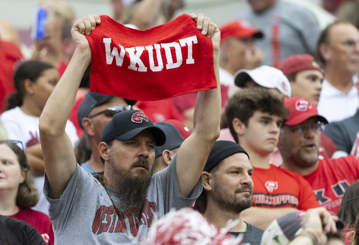 A Western Kentucky University of fan holds up a red towel during a game against Western Kentucky University at Bryant Denning Stadium in Tuscaloosa, Ala. on Saturday, Aug. 31, 2024.