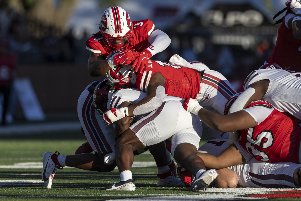 WKU defense brings down Eastern Kentucky Colonels running back Joshua Carter (8) during a game at L.T. Smith Stadium on Saturday, Sept. 7, 2024.