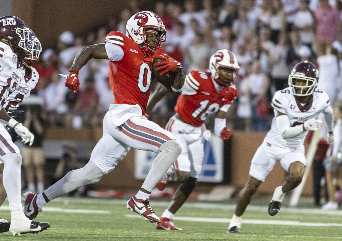 Western Kentucky Hilltoppers wide receiver Kisean Johnson (0) rushes with the ball after catching a pass during a game against Eastern Kentucky University at L.T. Smith Stadium on Saturday, Sept. 7, 2024.