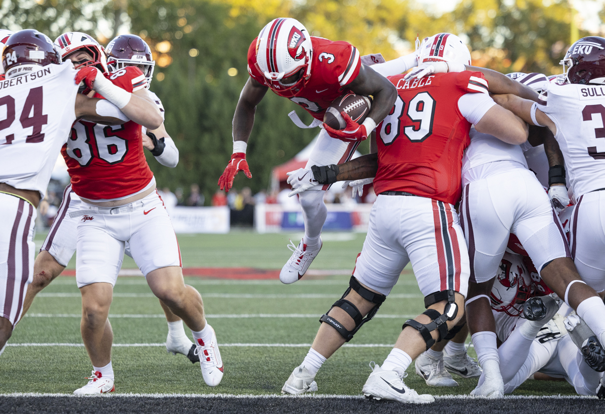 Western Kentucky Hilltoppers running back Elijah Young (3) jumps through the Eastern Kentucky Colonels defense to score a touchdown during a game at L.T. Smith Stadium on Saturday, Sept. 7, 2024.