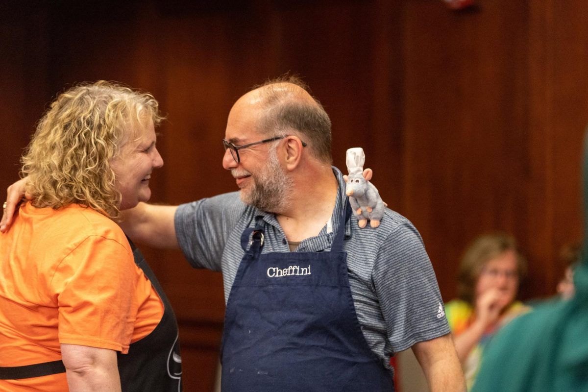 The two award winners David Serafini and Jen Hanley share an embrace after the “Great History Bake Off” in DSU (Downing Student Union) 3rd floor room 3020 on September 12 2024. (Photo by Gabriel Milby)