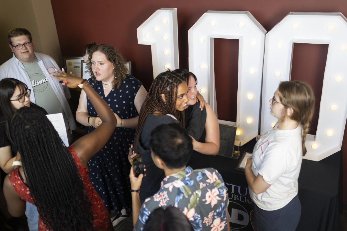 Members of the 100th Talisman staff gather in the lobby before being introduced to Talisman alumni at the Talisman Centennial Celebration in the Adams-Whitaker Student Publications building on Thursday, Sept. 5, 2024. 