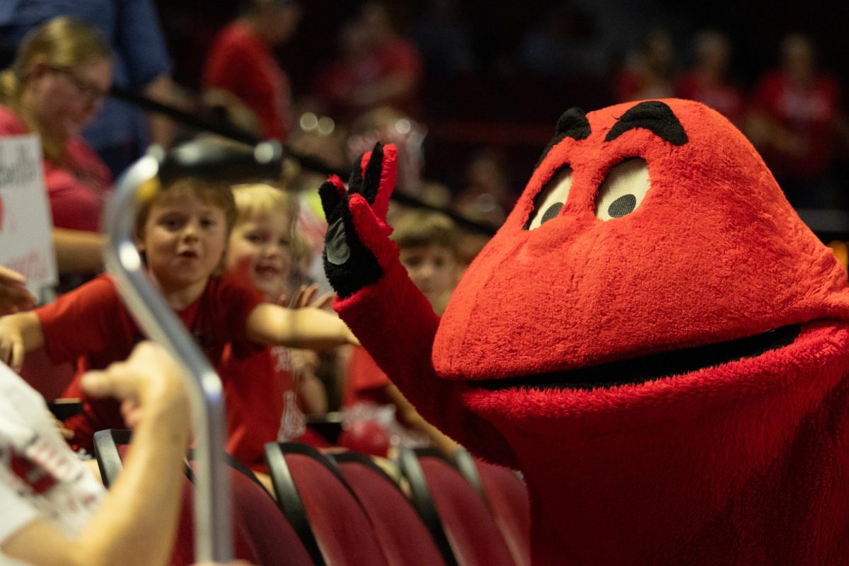 Big Red makes his way around the crowd to give high fives during the game against Arkansas State University at Diddle Arena on Friday, Sept. 20, 2024. 