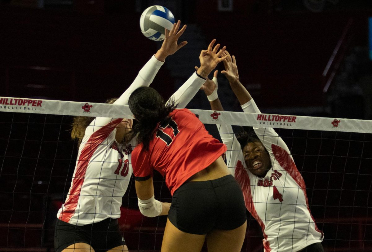 Outside hitter Alivia Skidmore (17) spikes the ball at Arkansas State University during a game at Diddle Arena on Friday, Sept. 20, 2024. 