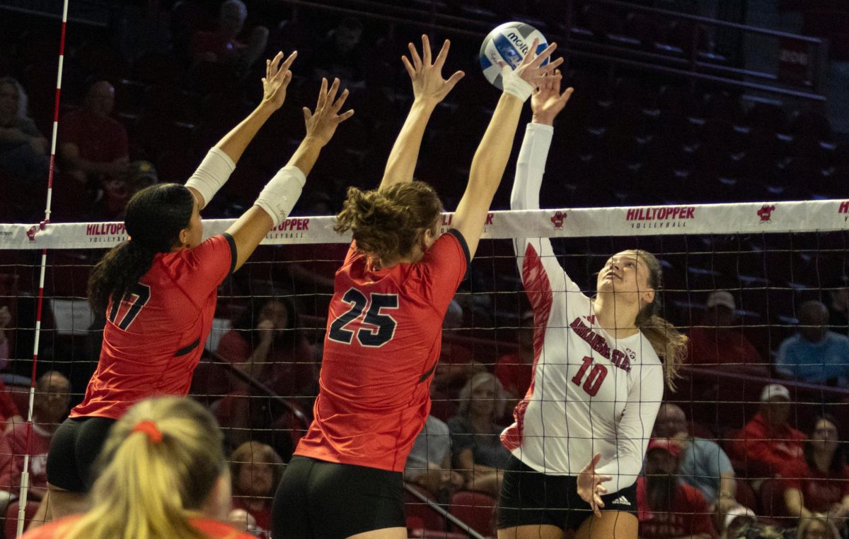 Outside hitter Alivia Skidmore (17) and middle hitter Izzy Van De Wiele (25) go up for a block during the game against Arkansas State University at Diddle Arena on Friday, Sept. 20, 2024. 