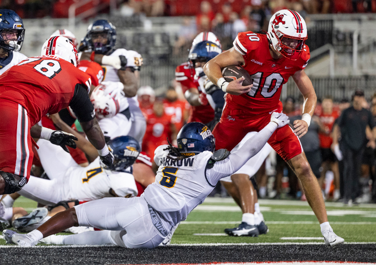 Western Kentucky Hilltoppers quarterback Caden Veltkamp (10) scores a touchdown during a game against the University of Toledo at Smith Stadium on Saturday, Sept. 21, 2024.