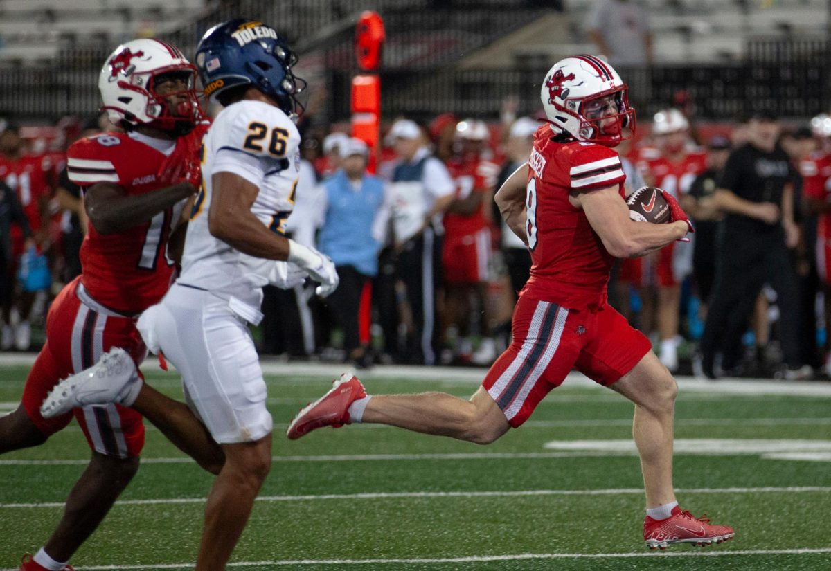 Western Kentucky Hilltoppers wide receiver Easton Messer (8) carries the ball during a game against University of Toledo at L.T. Smith Stadium on Saturday, Sept. 21, 2024.