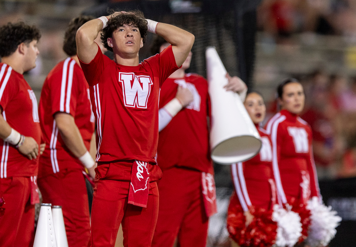 A WKU cheerleader puts his hands on his head after a fumble on the 19 yard line was ruled in favor of the University of Toledo with seconds left of a game at L.T. Smith Stadium on Saturday, Sept. 21, 2024.