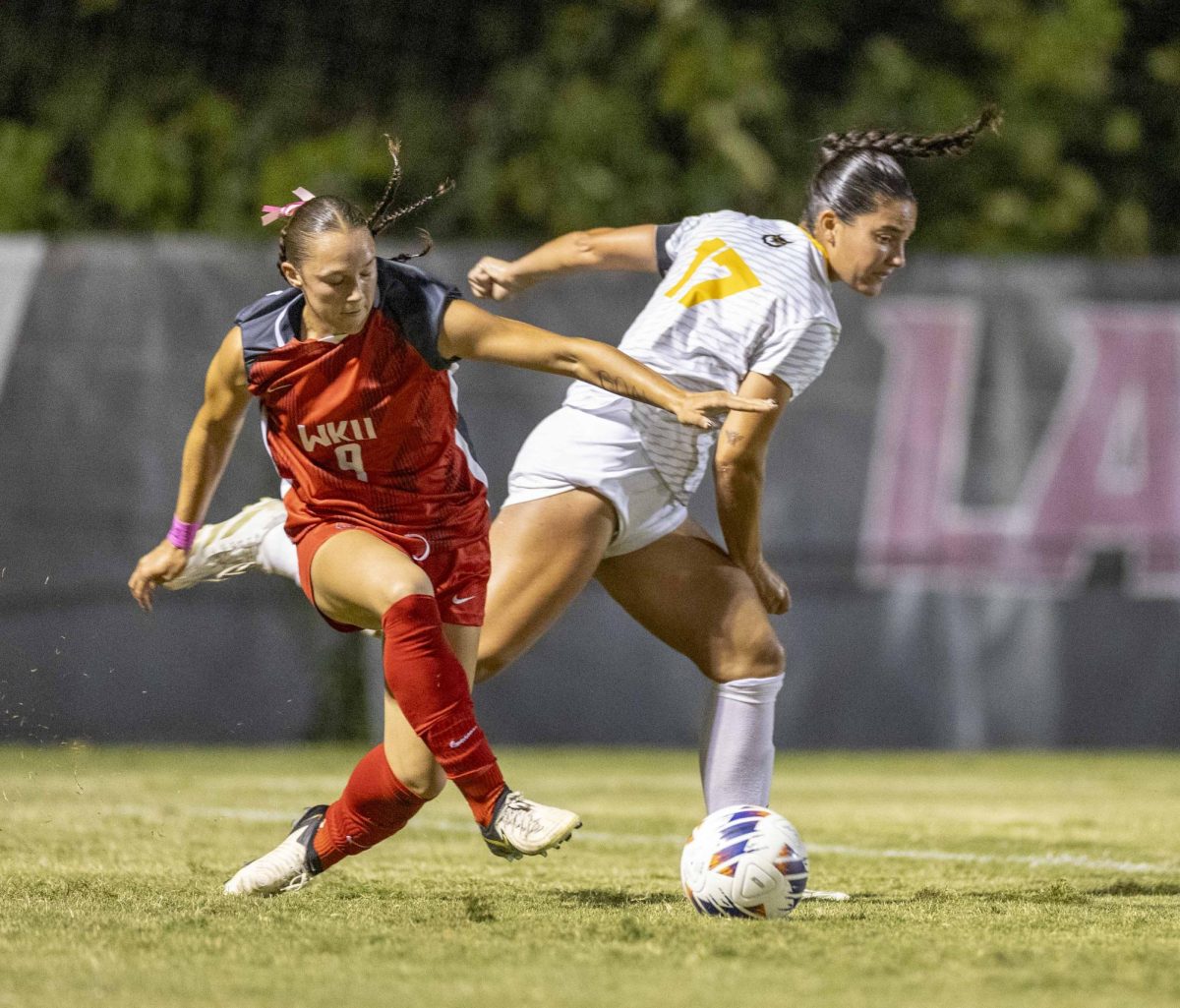 Western Kentucky Hilltoppers midfielder Maggie Morris (9) fights for the ball with Kennasaw State defender Jade Barkett (17) during their match at the WKU Soccer Complex on Thursday, Oct. 3, 2024.