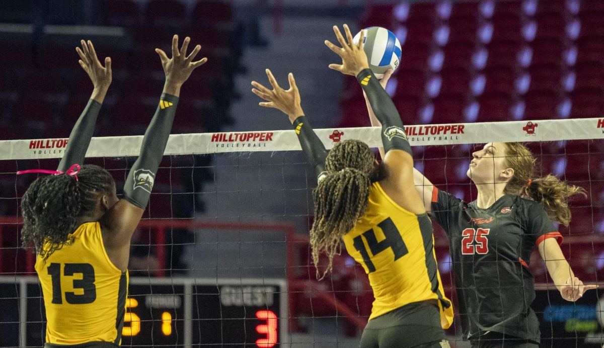 Western Kentucky University middle hitter Izzy Van De Wield (25) tips a ball during a match against Kennesaw State University at Diddle Arena on Saturday, Oct. 5, 2024.  