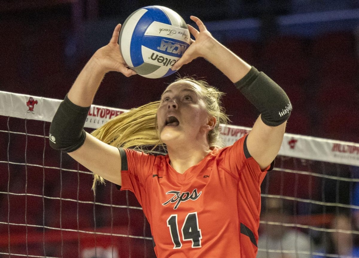 Western Kentucky University setter Callie Bauer (14) sets a ball during a match against Middle Tennessee State University at Diddle Arena on Sunday, Oct. 8, 2024.  