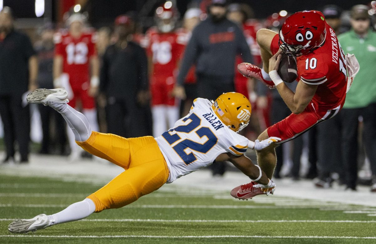 Western Kentucky Hilltoppers quarterback Caden Veltkamp (10) flies through the air after being tackled by University of Texas El Paso Miners safety Josiah Allen (22) during WKU’s game against The University of Texas at El Paso in Bowing Green, Ky. on Thursday, Oct. 10, 2024. 