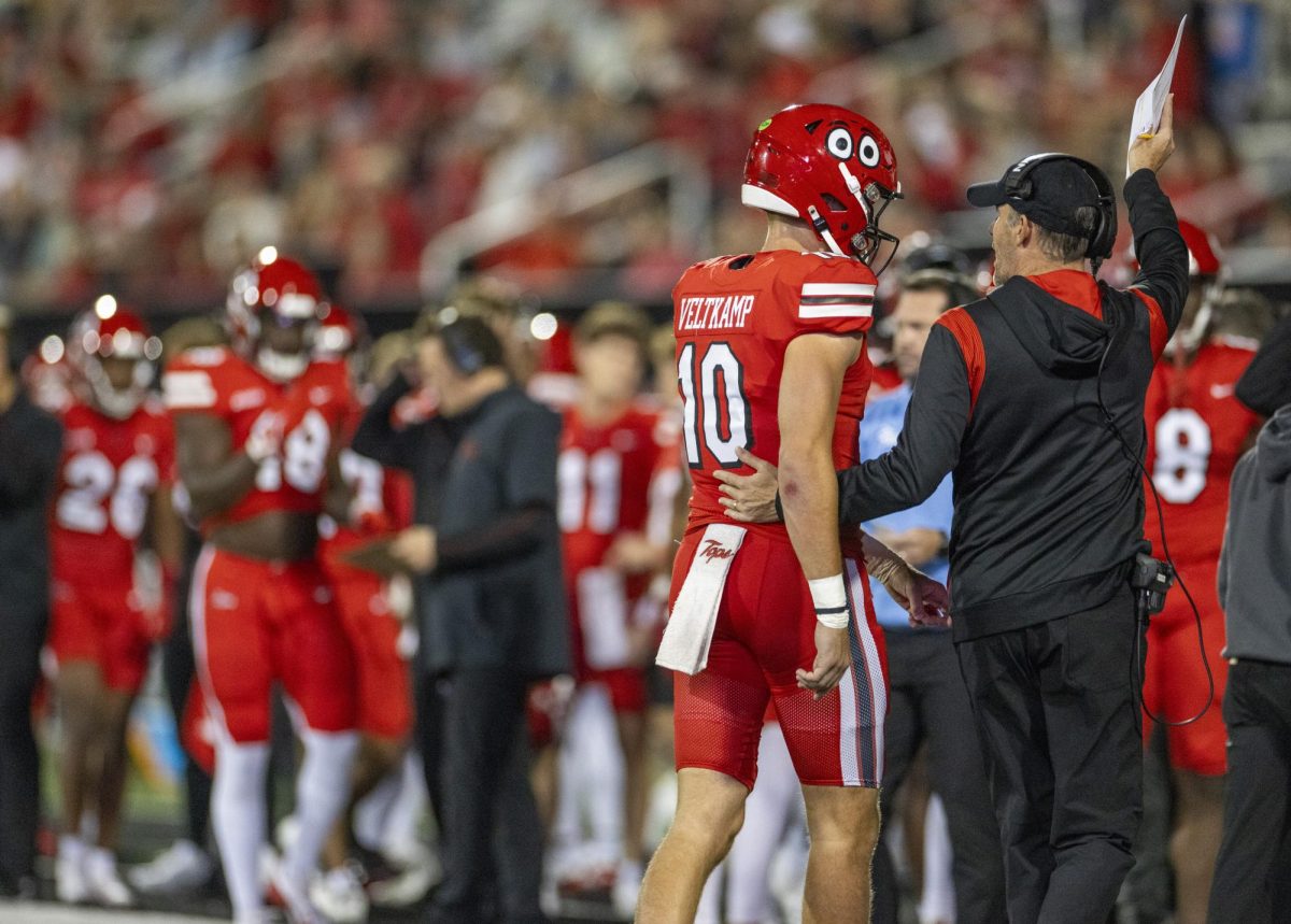 Head coach Tyson Helton talks to quarterback, Caden Veltkamp, during WKU’s game against The University of Texas at El Paso in Bowing Green, Ky. on Thursday, Oct. 10, 2024. 