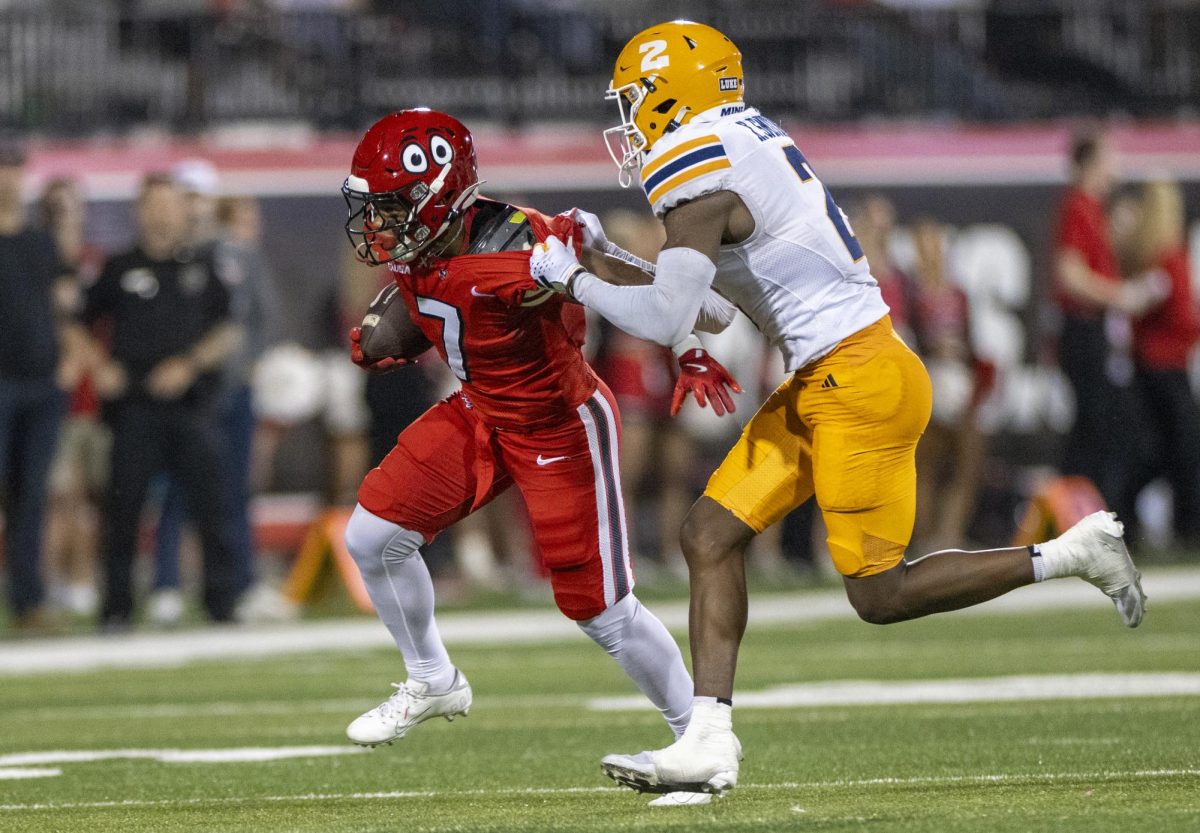 Western Kentucky Hilltoppers running back L.T. Sanders (7)  attempts to avoid a UTEP defender during WKU’s game against The University of Texas at El Paso in Bowing Green, Ky. on Thursday, Oct. 10, 2024. 