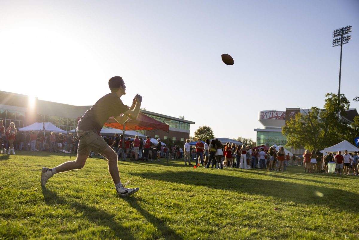 Tristan Martin, a freshman accounting major, catches a football during the tailgate before WKU’s game against The University of Texas at El Paso in Bowing Green, Ky. on Thursday, Oct. 10, 2024. 