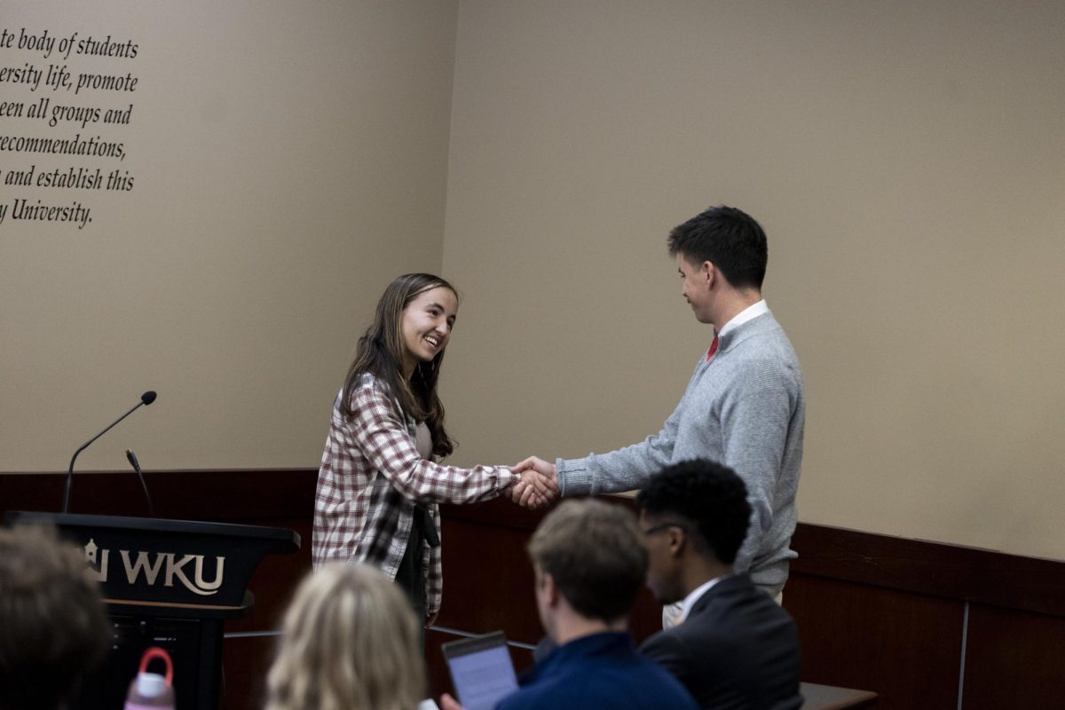 Syden Rettig is sworn into the Student Government Association as a nontraditional senator on Oct. 15, 2024 in the Senate Chambers in Downing Student Union. 