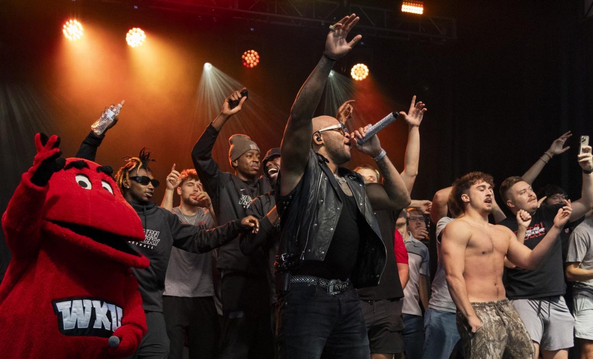 The WKU mens basketball team joins Flo Rida on stage during his performance on South Lawn prior to the WKU and Kennesaw State University football game on Wednesday, Oct. 30, 2024.