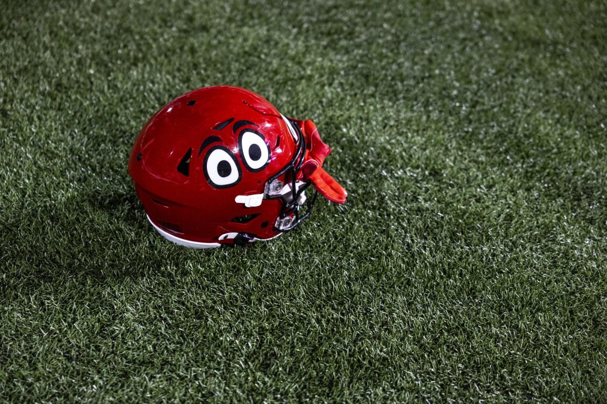 A lone helmet sits on the field after WKU’s game against The University of Texas at El Paso in Bowing Green, Ky. on Thursday, Oct. 10, 2024. 