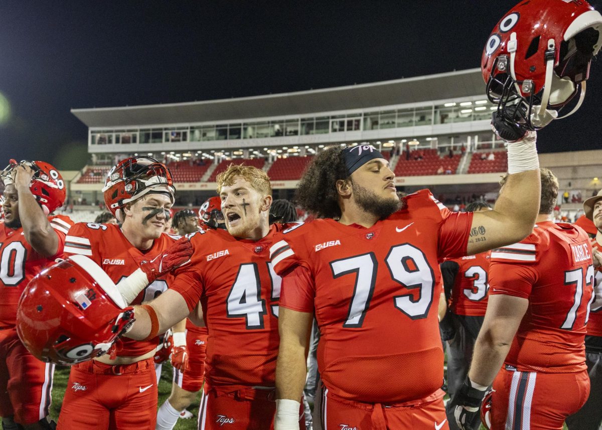 Western Kentucky Hilltoppers linebacker Nathan Griffin (45) and offensive lineman Blake Austin (79) celebrate their win after WKU’s game against The University of Texas at El Paso in Bowing Green, Ky. on Thursday, Oct. 10, 2024. 