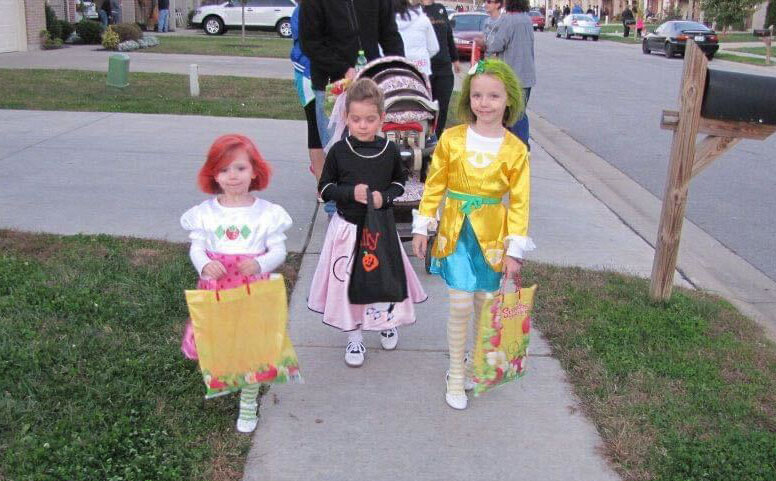 Emma Hardesty (right) and friends dressed up for a night of trick-or-treating on Halloween Night, 2011.