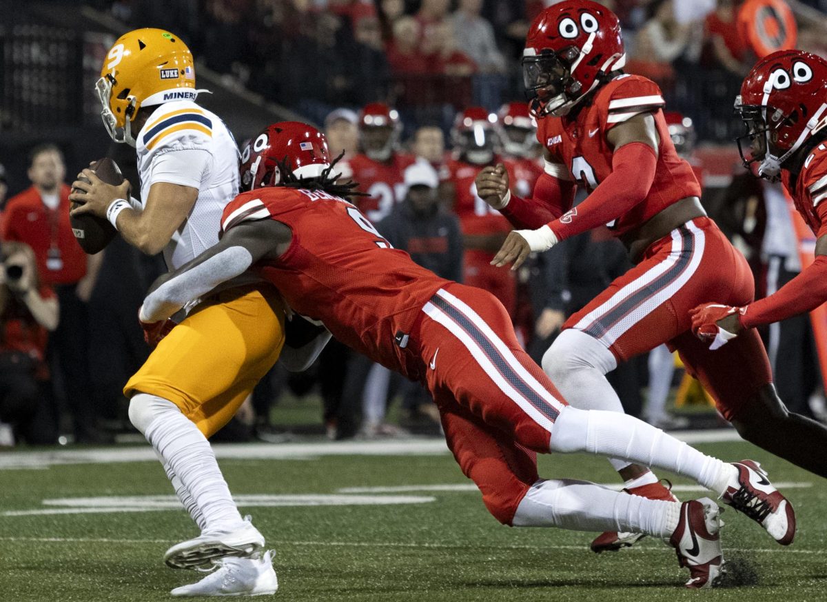 Western Kentucky Hilltoppers line backer Sebastian Benjamin (9) sacks the University of Texas at El Paso quarter back Skyler Locklear (9) during their matchup at Houchens Industries L. T. Smith Stadium in Bowling Green on Thursday, October 10, 2024. 