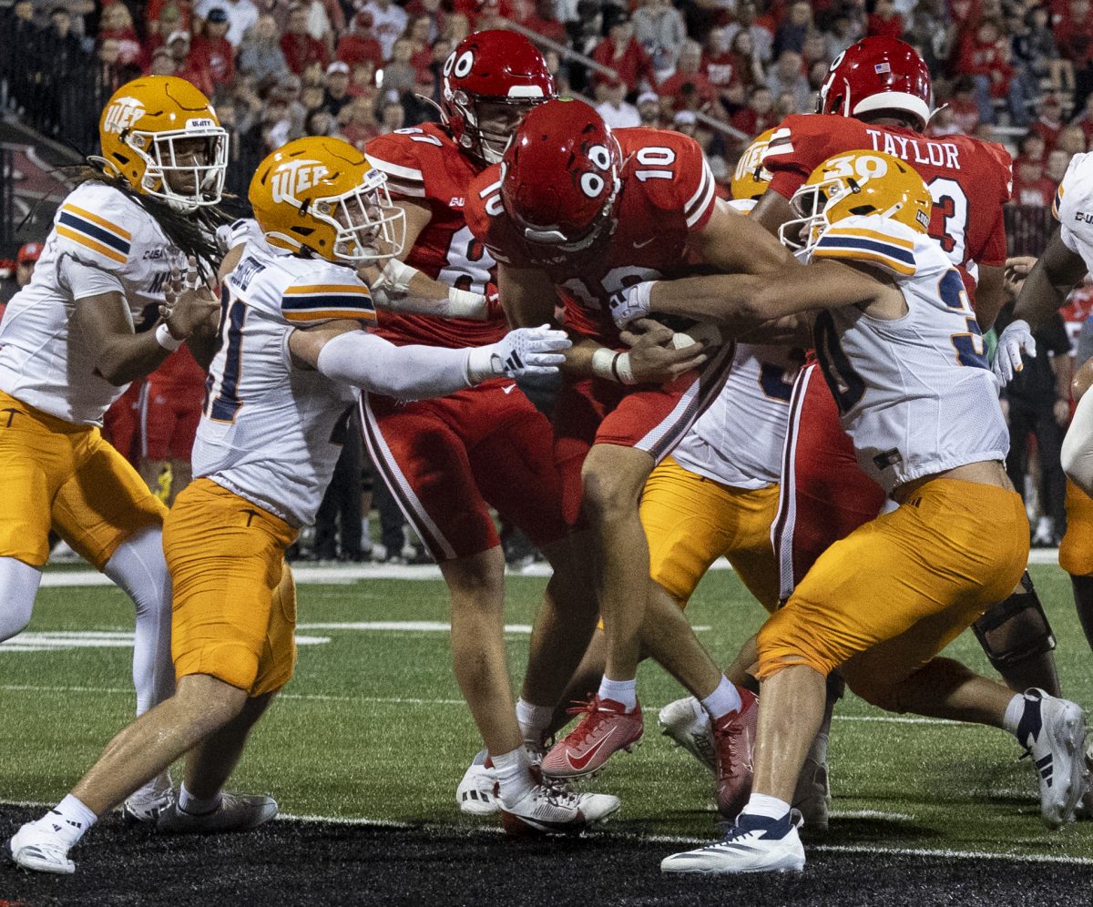 Western Kentucky Hilltoppers quarterback Caden Veltkamp (10) fights into the end zone for a touchdown during the matchup against the University of Texas at El Paso at Houchens Industries L. T. Smith Stadium in Bowling Green on Thursday, October 10, 2024. Veltkamp recorded three touchdowns and threw for 264 yards. 