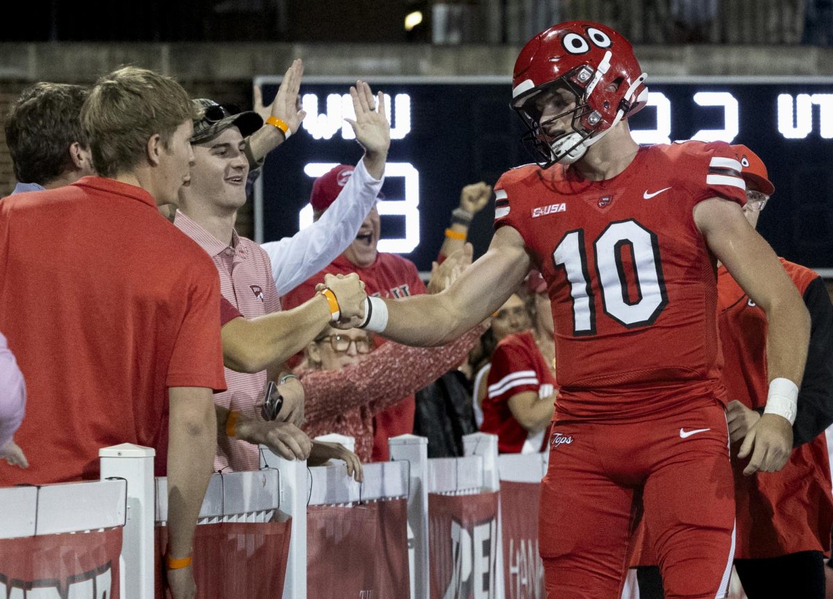 Western Kentucky Hilltoppers quarterback Kaden Veltkamp (10) celebrates with fans after a touchdown during the matchup against the University of Texas at El Paso at Houchens Industries L. T. Smith Stadium in Bowling Green on Thursday, October 10, 2024. 